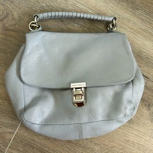 Coccinelle leather purse. Light blue, adjustable strap to wear cross body